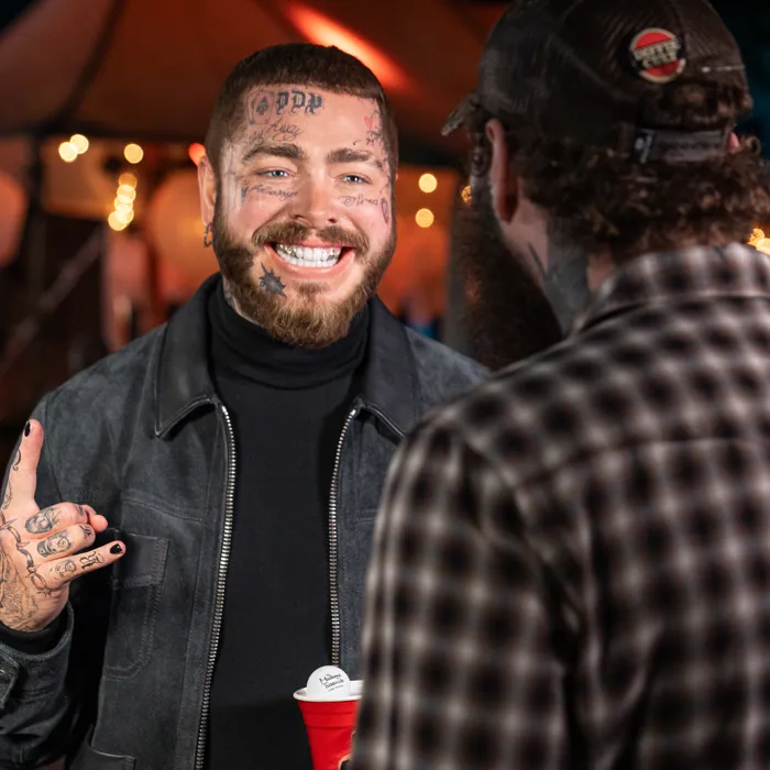 Post Malone looking at new wax figure at Madame Tussauds Las Vegas