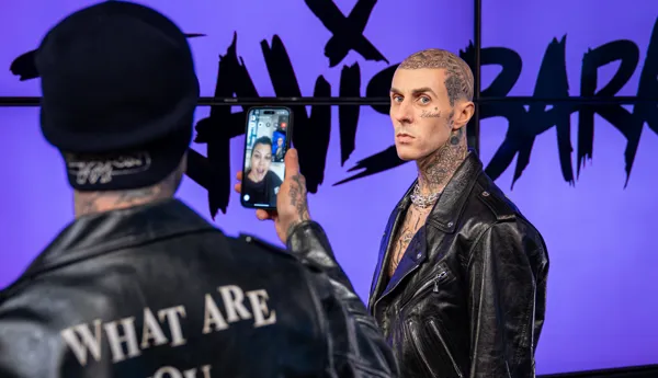 Travis Barker shows wax figure to Kourtney Kardashian at Madame Tussauds Las Vegas